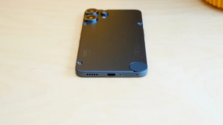 CMF Phone 2 Pro lying face down on a worktop, bottom view