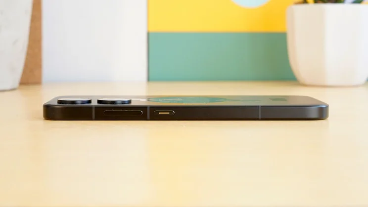 Poco X8 Pro face down on a table, side view