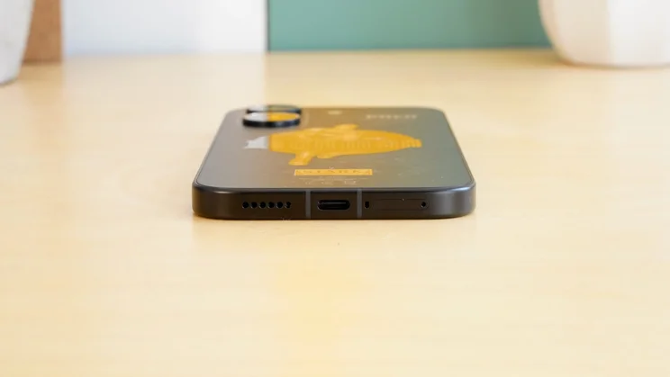 Poco X8 Pro face down on a table, bottom view