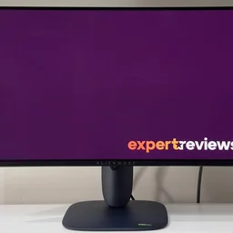 The Alienware AW2725D pictured from the front on a white desk against a white background