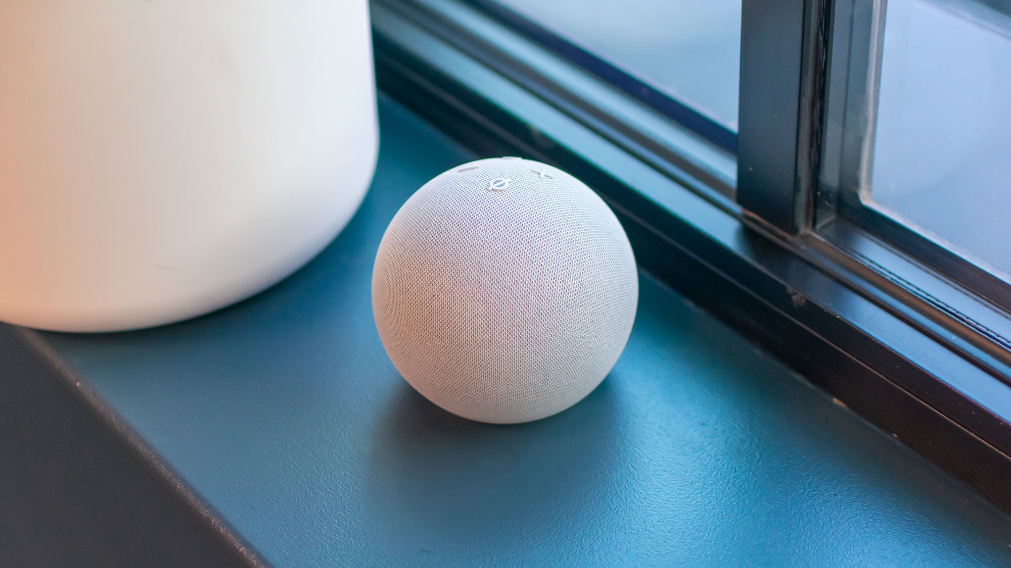 Amazon Echo Dot 5th generation (2022) on a window ledge