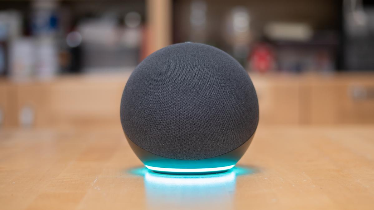 Amazon Echo 4th gen (2020) in charcoal on a wooden desk