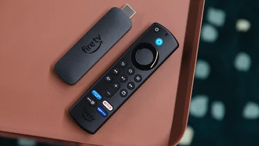 Amazon Fire TV Stick 4K 2nd gen remote and stick besides each other