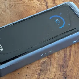 The Anker Prime A110A shown on a wooden table pictured from above, from the right side