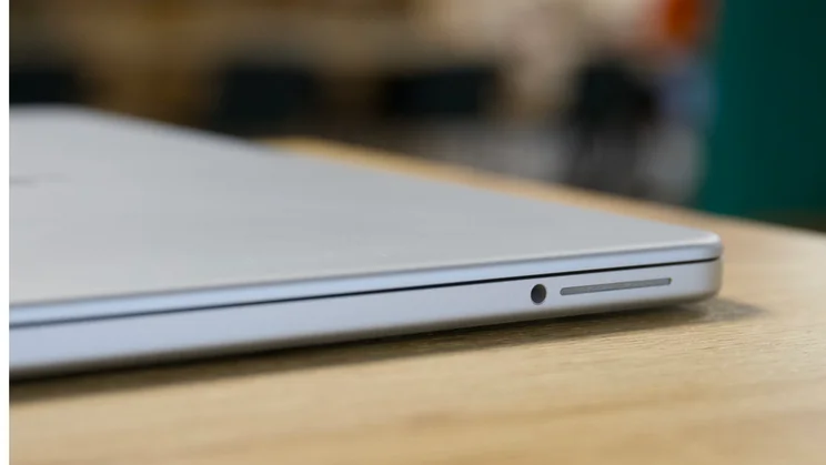 Apple MacBook Neo, closed, close up on the right front corner