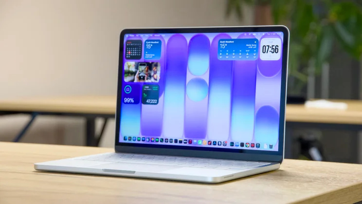 Apple MacBook Neo, open, pictured from the front right quarter