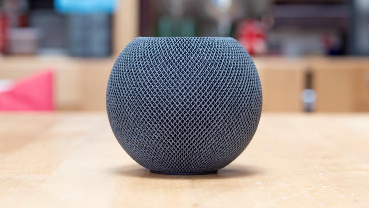 Apple HomePod mini in charcoal on a table