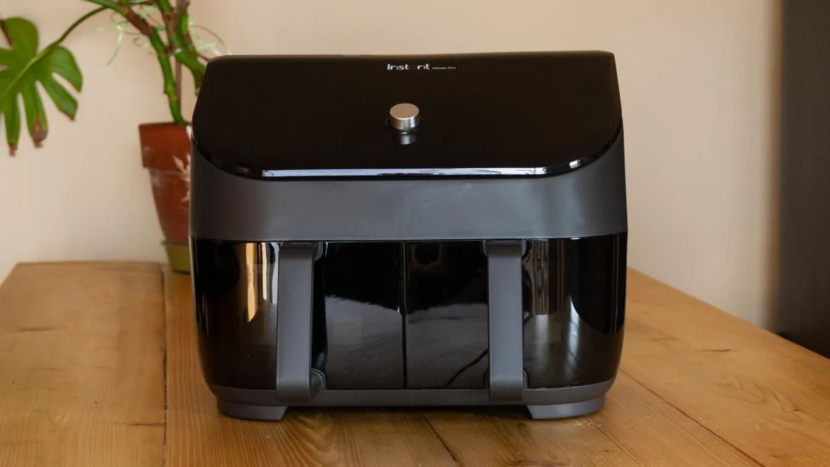 Instant Vortex Plus Dual Drawer on a kitchen island with a plant