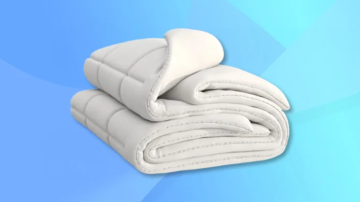 The Emma Cloud Duvet against a blue background