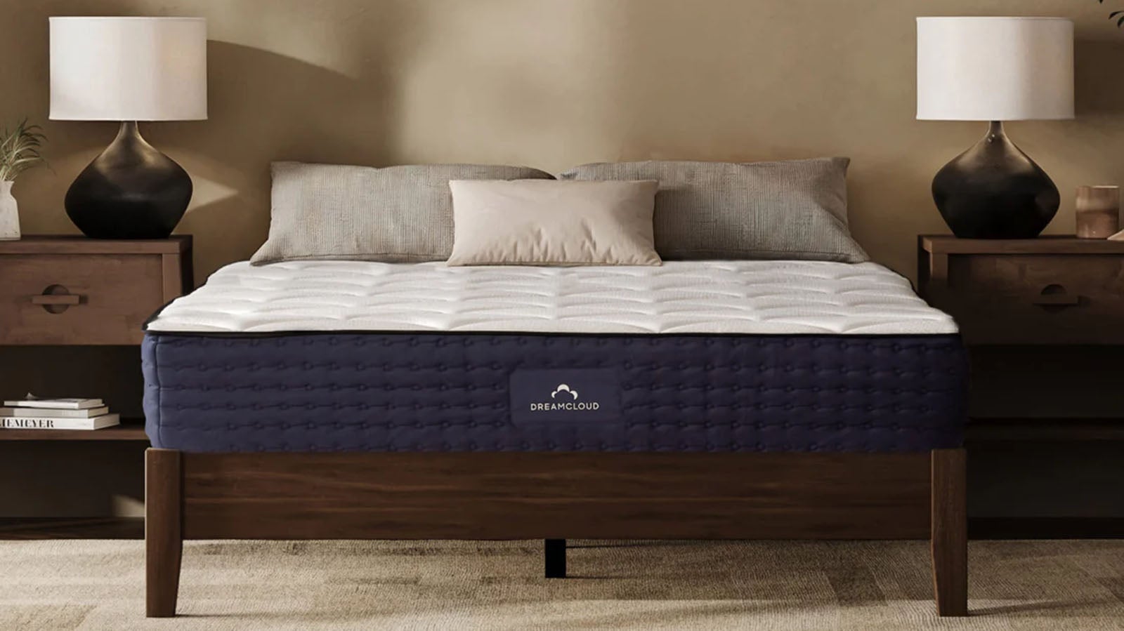 DreamCloud Hybrid mattress on a wooden bed