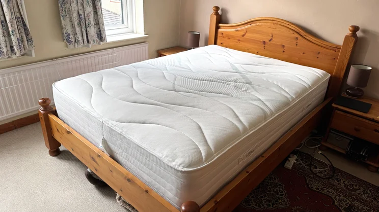 The Slumberland Air 6.0 Memory mattress on a bed in a bedroom