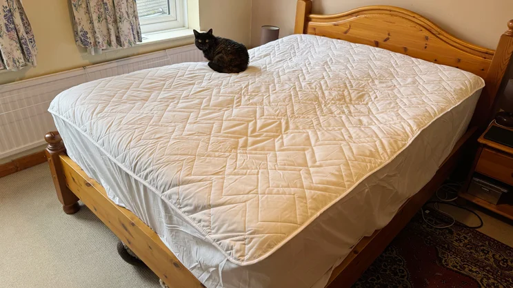 The Simba Performance Mattress Protector on a bed in a bedroom