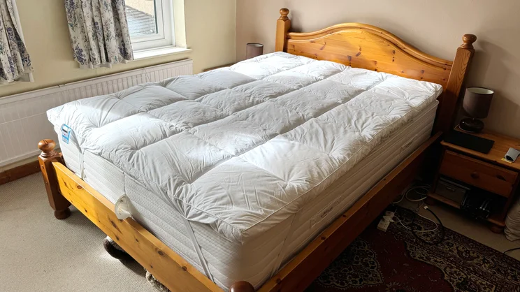 The Dorma Full Forever mattress topper on a bed in a bedroom