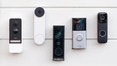 Five video doorbells attached to a wall