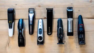 Best beard trimmer - eight beard trimmers on a wooden table