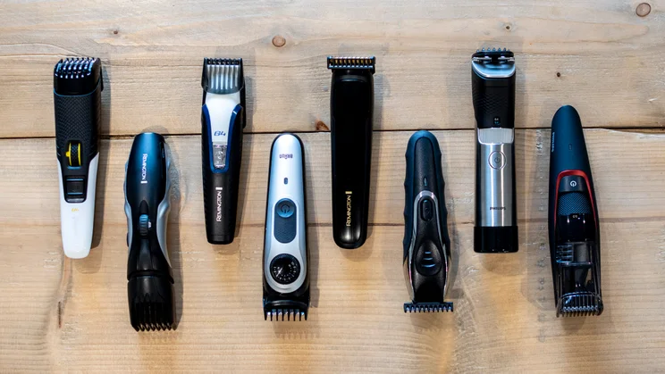 Best beard trimmer - eight beard trimmers on a wooden table