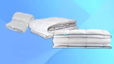 A selection of duvets on a blue backdrop