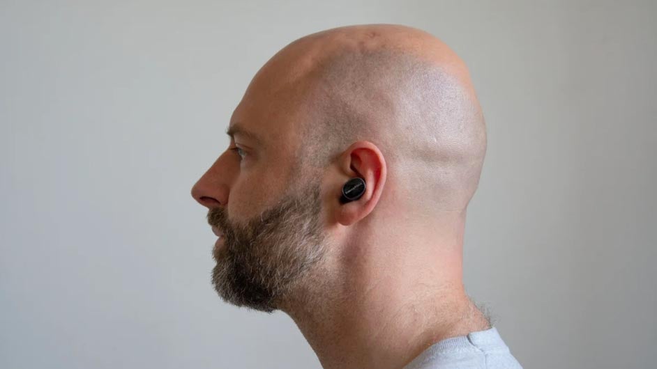 Image of one of the Expert Reviews team testing the Bowers & Wilkins Pi8 true wireless earbuds