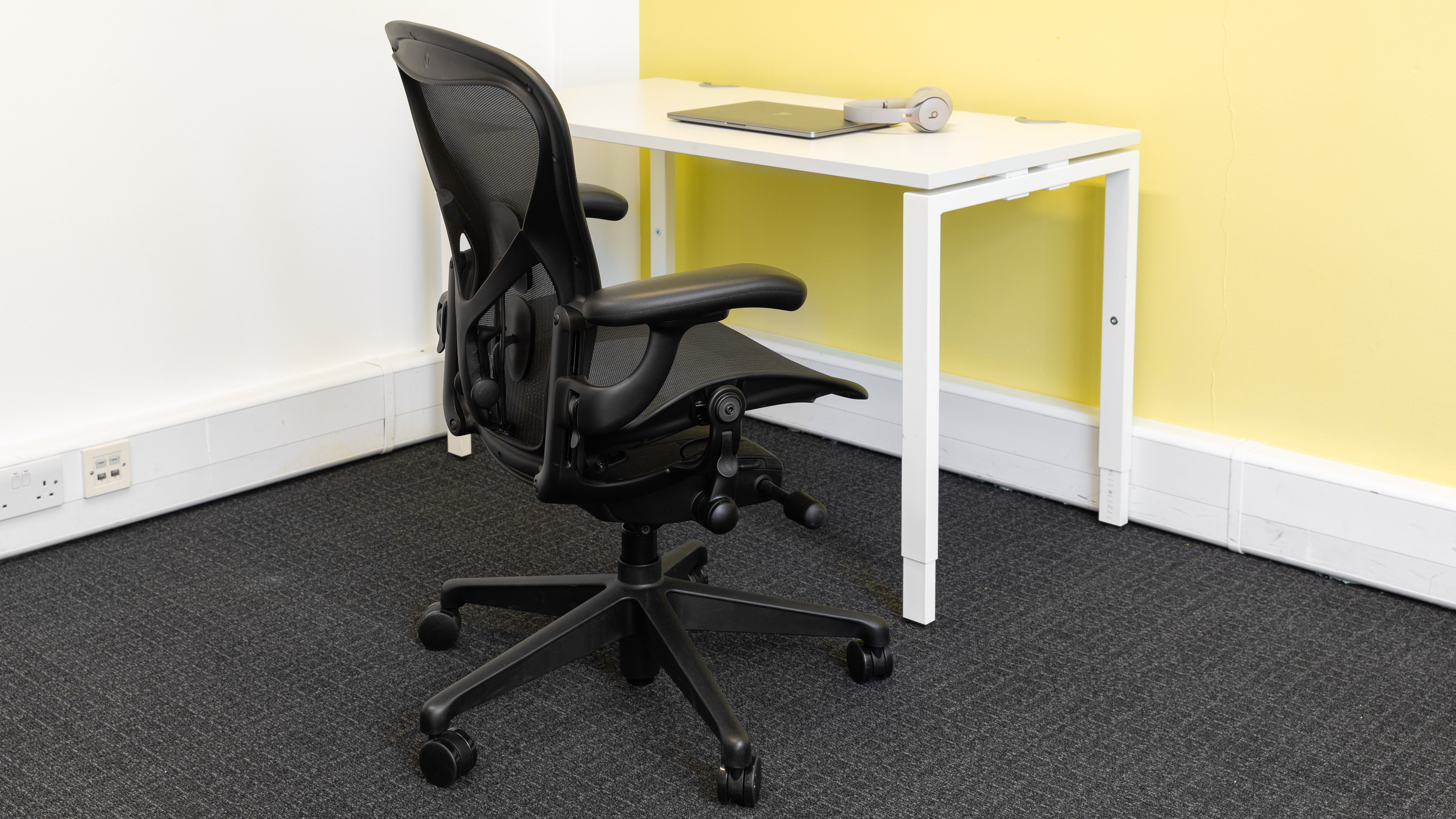 The Herman Miller Aeron at a desk in an office