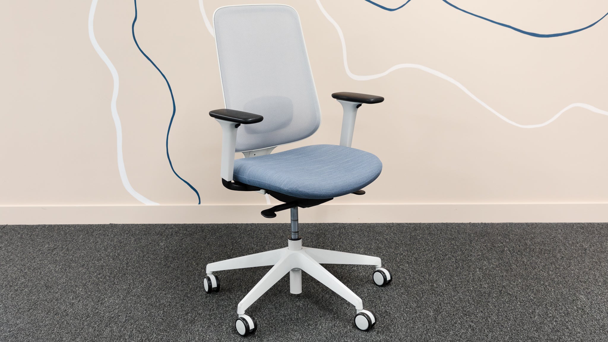 The Slouch Task One office chair against an office wall