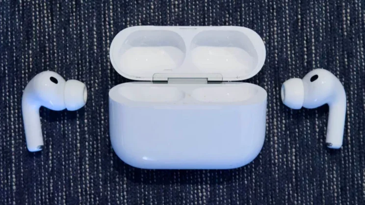 The Apple AirPods Pro 3 wireless earbuds outside of their charging case on a carpet