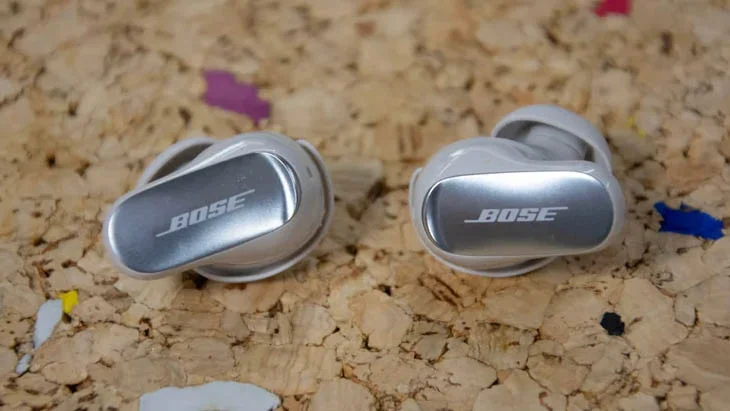 The Bose QuietComfort Ultra Earbuds (2nd Gen) wireless earbuds on a cork table