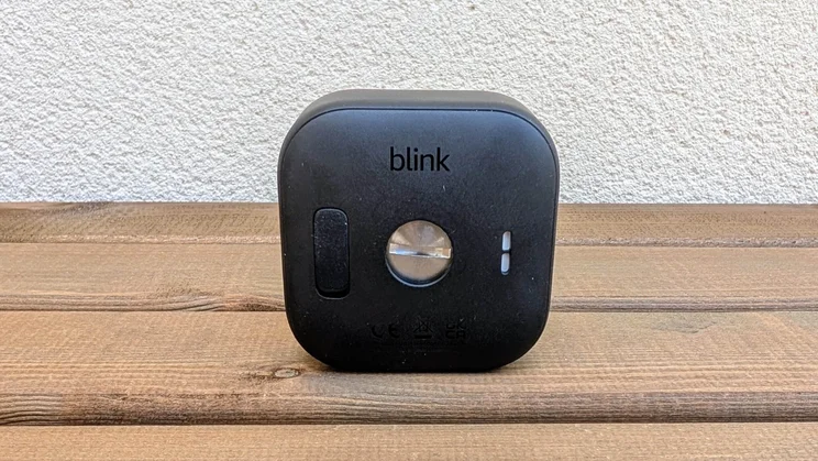Rear view of the Blink Outdoor 4 camera on a wooden table