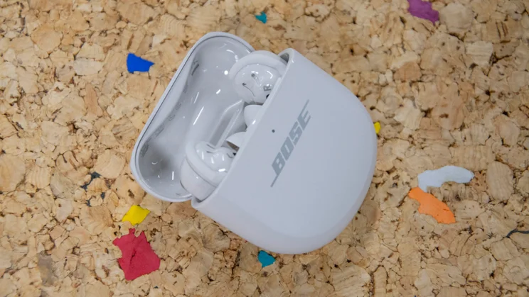 The Bose QuietComfort Ultra Earbuds 2nd Gen in their charging case with the lid open