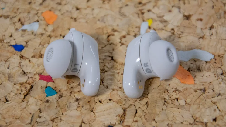 The Bose QuietComfort Ultra Earbuds 2nd Gen on a cork table with their eartips facing outwards