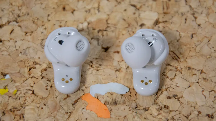 The Bose QuietComfort Ultra Earbuds 2nd Gen on a cork table with their eartips facing upwards