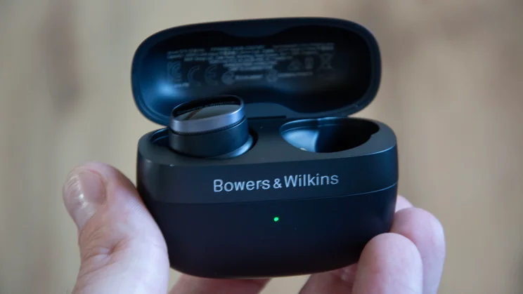 Image of the Bowers & Wilkins Pi8 with the charging case open with one earbud inside