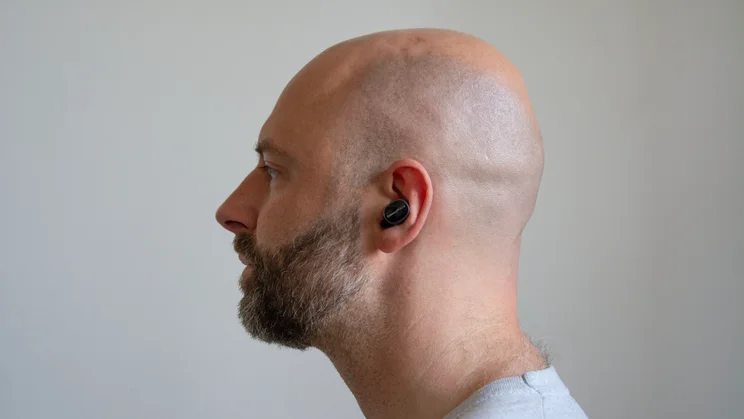 Side view of the Bowers & Wilkins Pi8 being worn