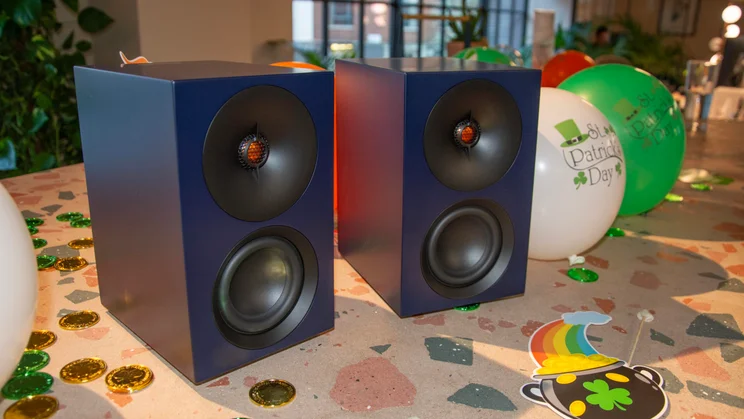 The Cambridge Audio L/R S active speakers side-by-side on a table with St Patrick's Day balloons
