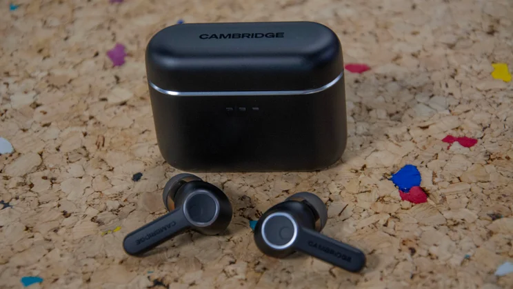 The Cambridge Audio Melomania A100 wireless earbuds alongside their charging case