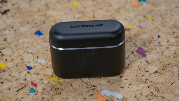 The Cambridge Audio Melomania A100 wireless earbuds charging case closed on a cork table