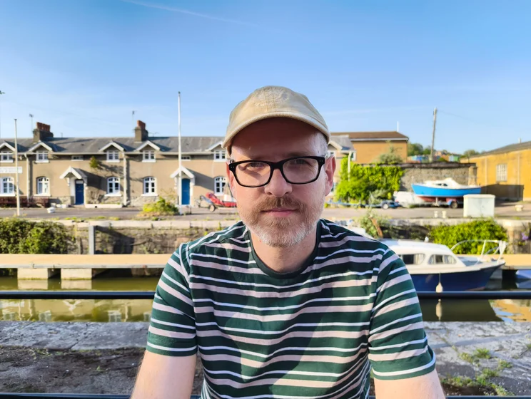 Author Jon Mundy in front of a river