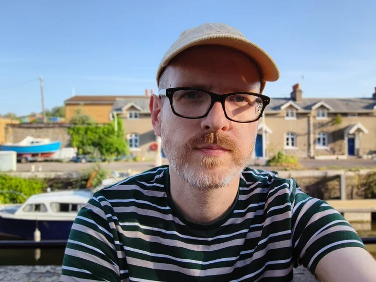 Selfie of author Jon Mundy in front of a river