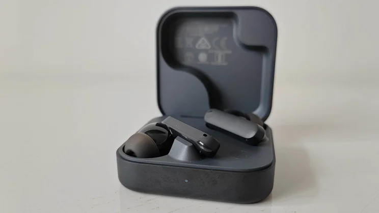 The CMF Buds 2 wireless earbuds in their charging case with the lid open
