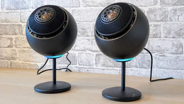 creative_pebble_nova_review_featured_image black round speakers on stands