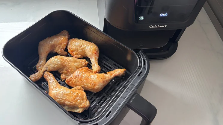 Cooked chicken legs in the drawer of the Cuisinart Compact Max Air Fryer