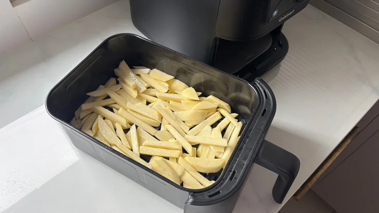 Raw chips in the drawer of the Cuisinart Compact Max Air Fryer
