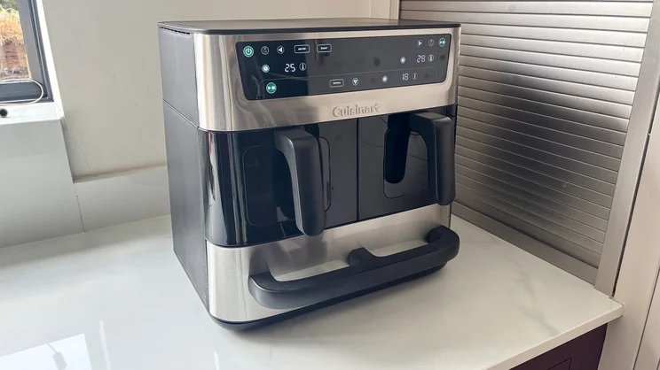 The Cuisinart Tri Zone 13.6l Air Fryer & Oven on a kitchen worktop, its display turned on