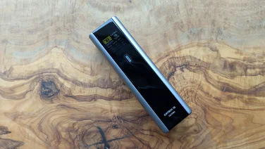 The Cuktech 15 Ultra power bank pictured on a wood table
