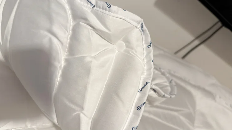 A closeup of one of the Emma All Seasons Customisable Duvet's corners, and snap fastener