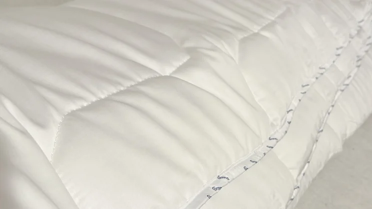 A closeup of the surface and side of the Emma All Seasons Customisable Duvet