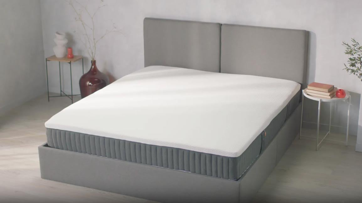 Bed with Emma NextGen Premium Mattress in bedroom