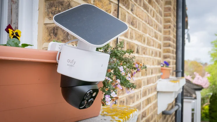 The Eufy S340 security camera mounted on a planter on a windowsill