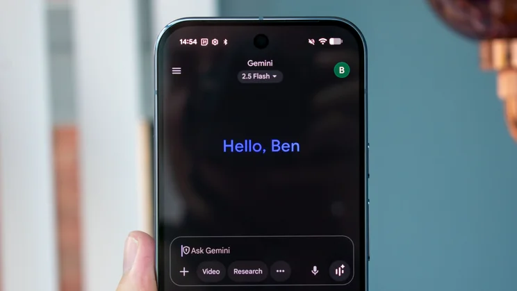 Google Pixel 10 Pro in hand, showing Google Gemini on the display