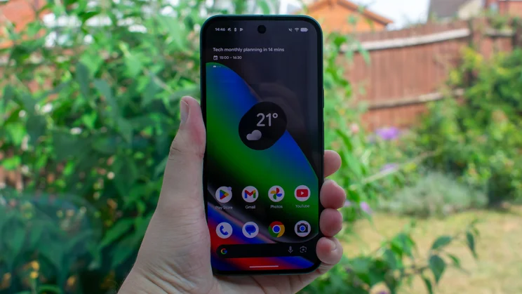 Google Pixel 10 in hand, front view, display on