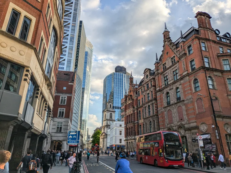 Tall buildings on either side of a busy London road